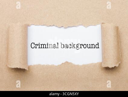 Criminal Background concept text appearing behind torn brown paper envelope Stock Photo