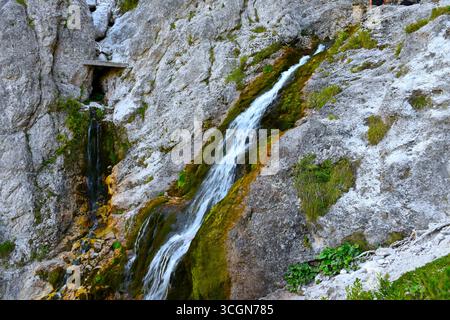 Waterfall flowing down rocks in Tamar, Slovenia Stock Photo
