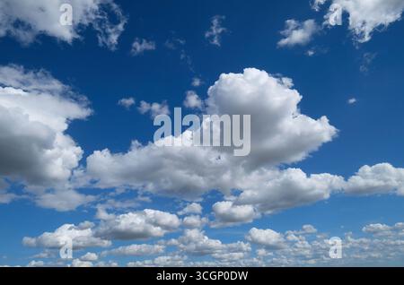 white clouds on bright blue sky, norfolk, england Stock Photo