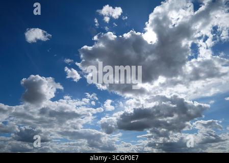 white clouds on bright blue sky, norfolk, england Stock Photo