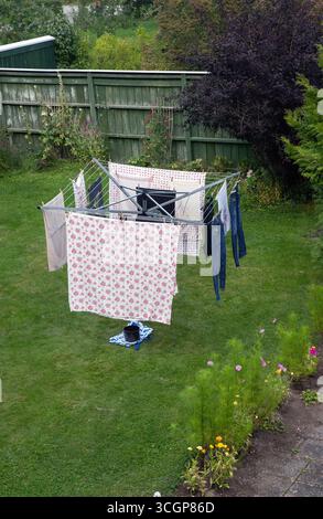 clothes drying rack with laundry in the garden Stock Photo
