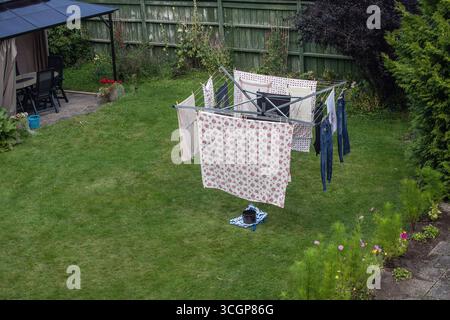 clothes drying rack with laundry in the garden Stock Photo