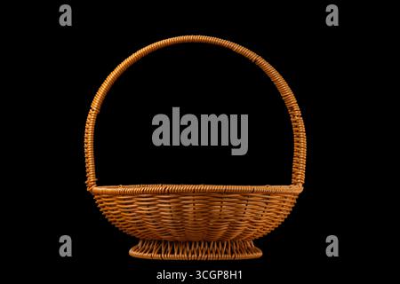 wicker rattan basket on black background Stock Photo