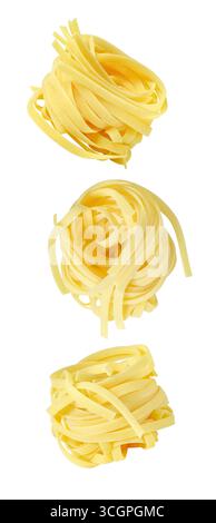 set of falling soaring flying nests of raw tagliatelle, isolated on white background Stock Photo