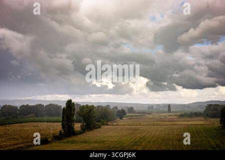 Storm approaching with large clouds across the countryside of South West France Stock Photo