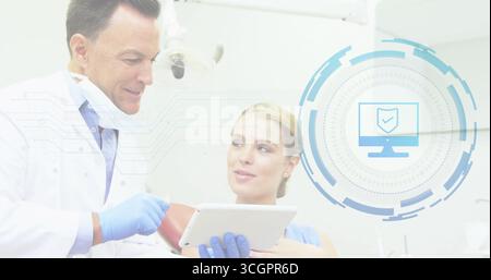 Dentist in coat explaining data in dental clinic using tablet and interface graphic, copy space Stock Photo