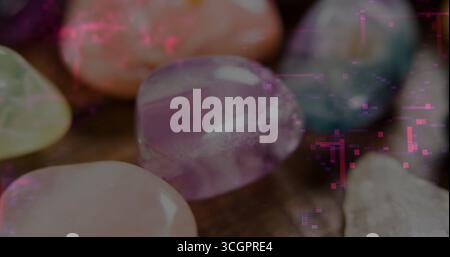 Showcasing gems on wood table, featuring amethyst rose quartz aventurine and blue-white stones Stock Photo