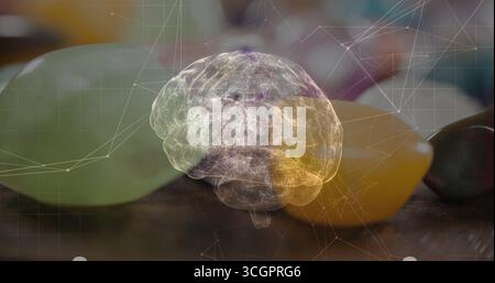 Floating translucent brain hologram showing network nodes above wooden table, green yellow fruits Stock Photo
