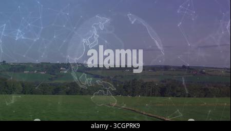 Hovering semi-transparent globe floating above pasture with narrow path, displaying network lines Stock Photo