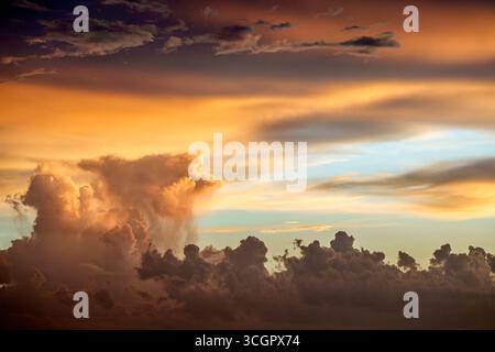 Miami Florida,sky clouds weather,rainfall core storm tower cumulonimbus climate change global warming,sunset yellow red blue pastel streaks cloudburst Stock Photo