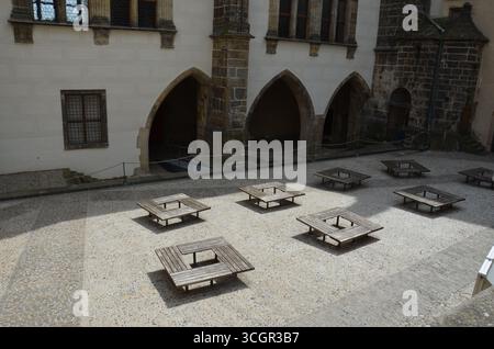 Square Wooden Benches on Castle Courtyard Stock Photo