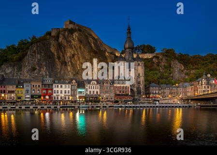 Citadel and 13th-century Collegiate Church of Notre Dame de Dinant in the city along the river Meuse at dusk, province of Namur, Wallonia, Belgium Stock Photo