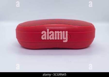 Red Bluetooth Speaker with Control Buttons Stock Photo