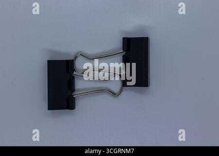 Small Office Binder Clips Isolated on Plain White Background Stock Photo