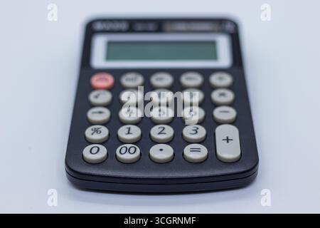 Small Office Calculator on Desk Stock Photo