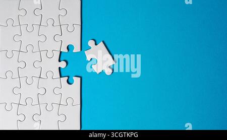Last piece to complete the jigsaw puzzle business solution and problem solving concept top view with copy space. Stock Photo