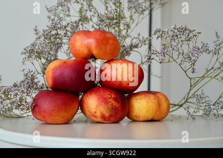 Ripe nectarines on a table in a rustic style Stock Photo