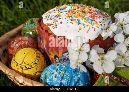 Easter egg with icing on the grass for Easter and eggs painted Stock Photo