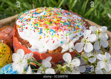 Easter holiday, closeup on the grass Easter cake with Easter eggs Stock Photo