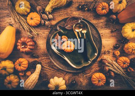 Festive Thanksgiving table setting with pumpkins and candles in autumn colors Stock Photo