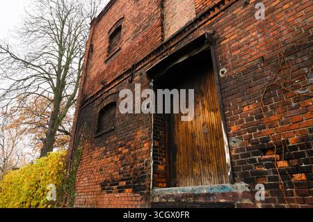 Abandoned brick house burned and damaged by fire. Stock Photo
