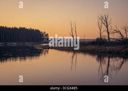 Sunset over Bug river, viewpoint near Szumin, small village in Masovian Voivodeship of Poland Stock Photo