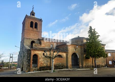 El Salvador Church in Celadilla del Rio with brick bell tower and arched entrance Stock Photo