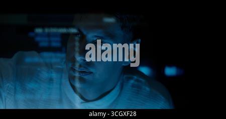 Programmers and coding. Programmer or Developer working in dark room with computer code reflected on their monitor. Cybersecurity software development Stock Photo