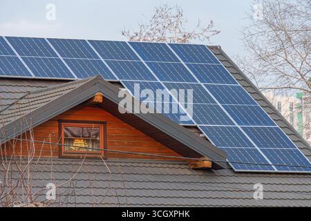 Image of a wooden, solar-powered residential building in a suburbanrural setting, showcasing sustainable living and eco-friendly aesthetics Stock Photo