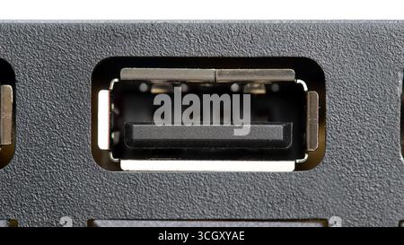 Macro closeup of an USB type A female port on a computer device, frontal view of empty standard interface connector socket, input output power chargin Stock Photo