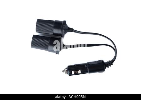 Electrical outlet splitter for cigarette lighter charging cords on white background. Copy space. Stock Photo