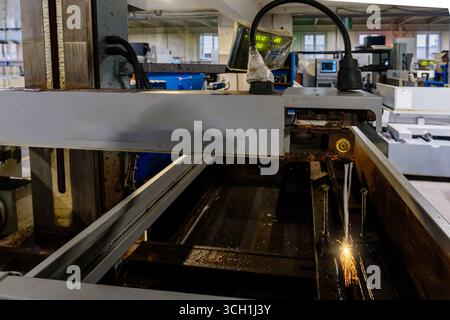 Working plasma cutter with water coolant. Stock Photo