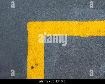 Yellow painted right angle line on pedestrian walkway for organizing traffic Stock Photo