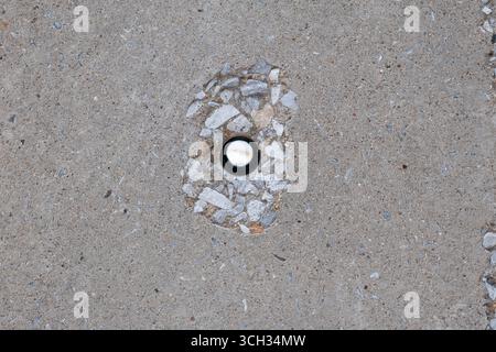 A hole in a concrete electrical pole Stock Photo