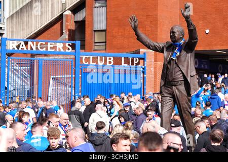 Rangers fans by a statue of former Rangers manager Walter Smith outside the stadium before the William Hill Premiership match at Ibrox Stadium, Glasgow. Picture date: Sunday August 31, 2025. Stock Photo
