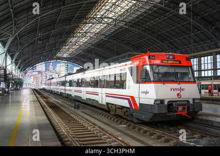 A RENFE intercity train in The Abando Indalecio Prieto railway station,   in the center of Bilbao, Biskaia, Basque country, Northern Spain. Stock Photo