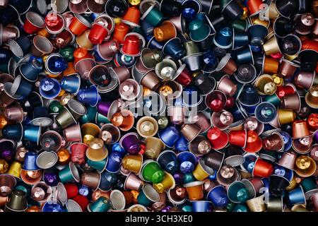 Large group of colorful used coffee capsules, Seen directly above. Horizontal Background texture. Stock Photo
