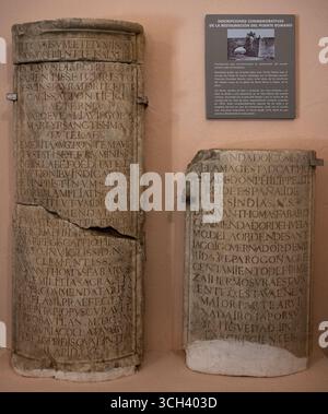 Merida, Spain - 3 April 2023: Two ancient stone tablets with Latin inscriptions displayed on a wall. Stock Photo