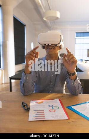 Businessman in the office interacting to augmented reality or virtual ...