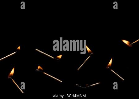 Lit and falling match on a black background. Stock Photo