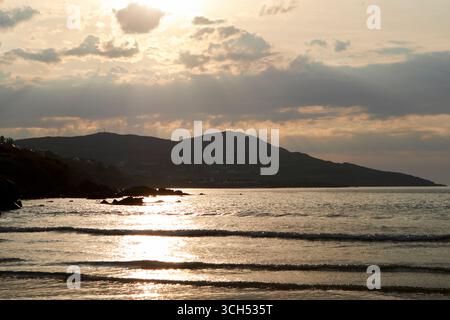 sun setting over the sea narin portnoo beach county donegal republic of ireland Stock Photo