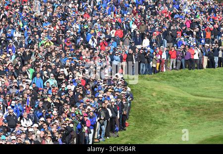 Sep 26, 2014; Gleneagles, Perthshire, SCT; Crowds line the 16th fairway to watch the fourball matches on day one of the 2014 Ryder Cup at Gleneagles Resort - PGA Centenary Course. Stock Photo