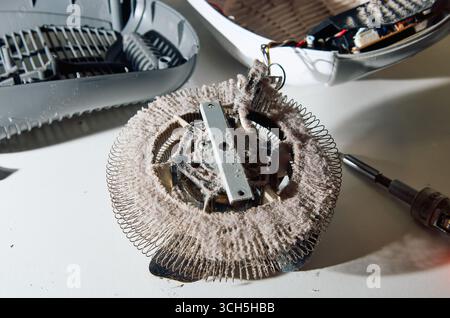 Close-up of Fan Heater with Dust on Heating Element – Dirty Home Appliance Detail Stock Photo