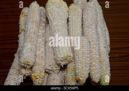 the corn cobs after the kernels have been removed, the edible seeds of the maize plant, typically yellow or white, a source of dietary fiber that aids Stock Photo
