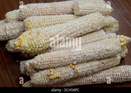 the corn cobs after the kernels have been removed, the edible seeds of the maize plant, typically yellow or white, a source of dietary fiber that aids Stock Photo