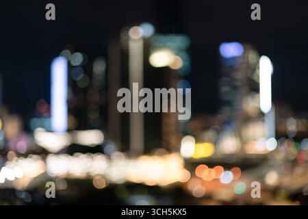 A defocused night view of the city of Kuala Lumpur, creating a bokeh effect from the urban street and building lights. Stock Photo