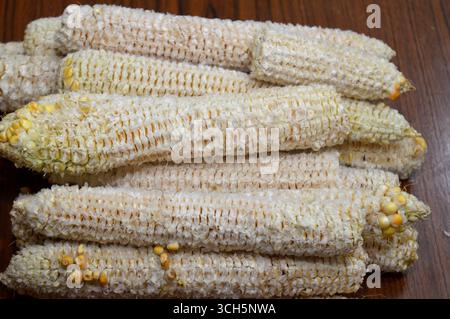 the corn cobs after the kernels have been removed, the edible seeds of the maize plant, typically yellow or white, a source of dietary fiber that aids Stock Photo