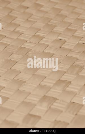 Thin strips of bamboo woven into a grid pattern background backdrop. Stock Photo