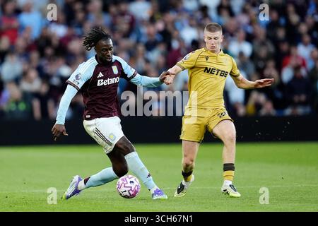 Aston Villa's Evann Guessand (left) and Bologna's Charalambos