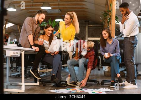 Teamwork. Creative colleagues discussing interior designs with palettes Stock Photo